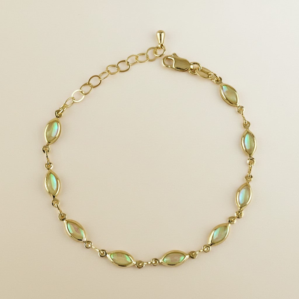 ✨ 18k Gold Filled Opal Ellipse Bracelet — Ten Stones. Ten Fires. One Wrist That Can't Be Ignored.