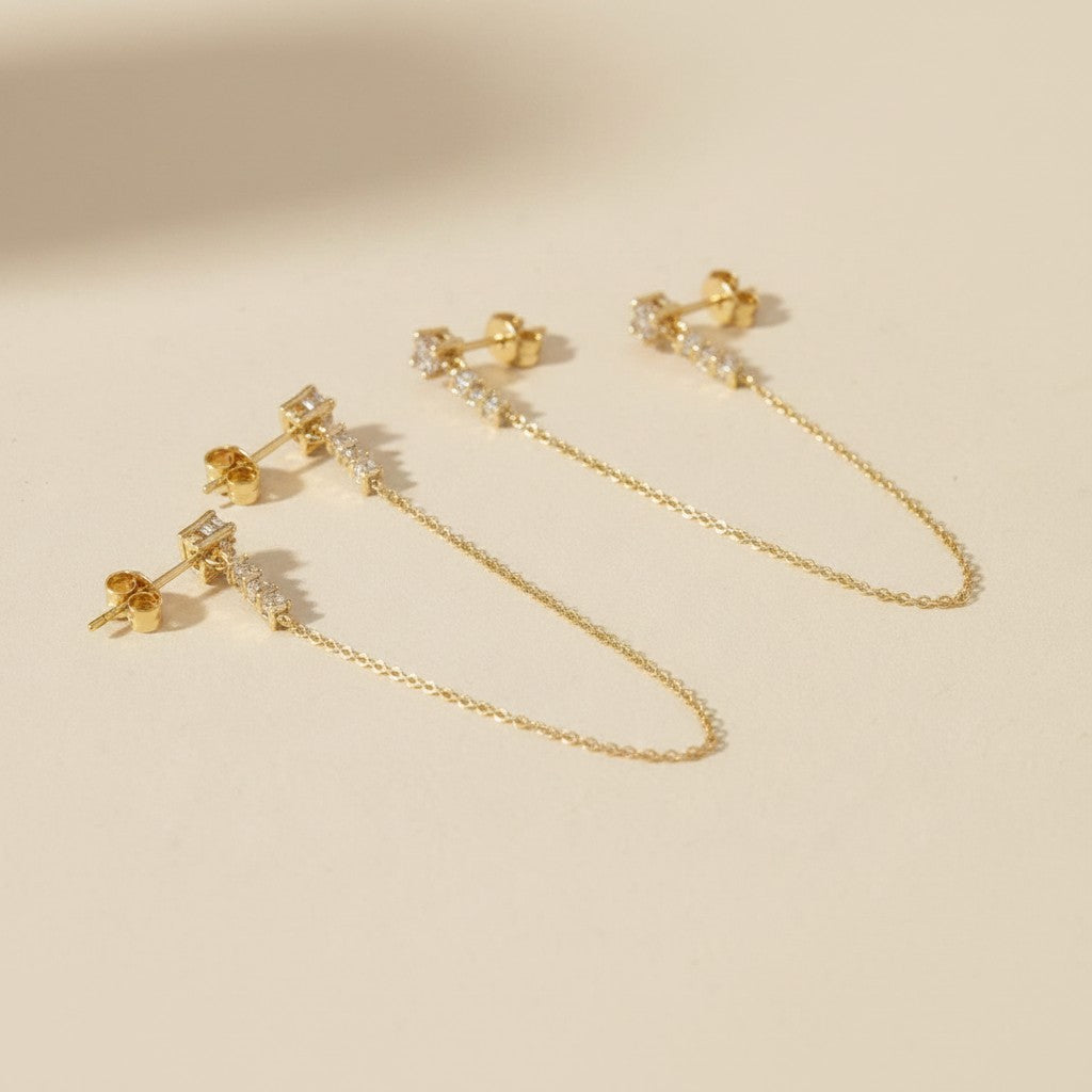 ✨ 18k Gold Filled CZ Double Piercing Chain Earrings — Two Studs. One Chain. The Ear Stack Elevated.