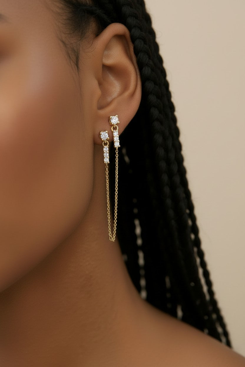 ✨ 18k Gold Filled CZ Double Piercing Chain Earrings — Two Studs. One Chain. The Ear Stack Elevated.