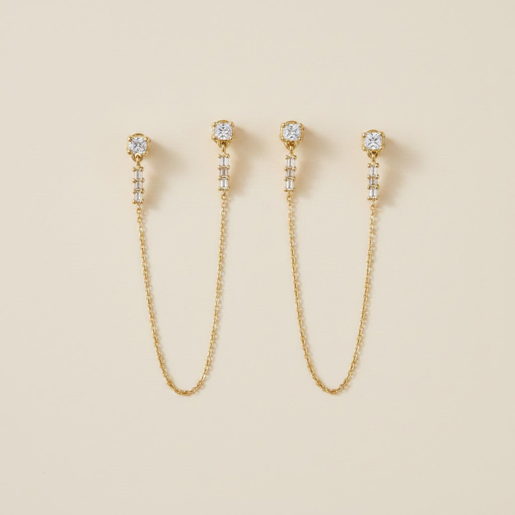 ✨ 18k Gold Filled CZ Double Piercing Chain Earrings — Two Studs. One Chain. The Ear Stack Elevated.